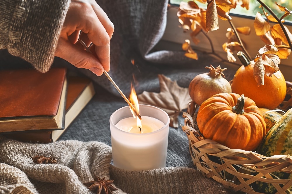 Hand,With,Burning,Match,Lighting,A,Candle,On,The,Windowsill